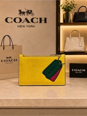 COACH Yellow Leather Zip Card Case with Tag Motif